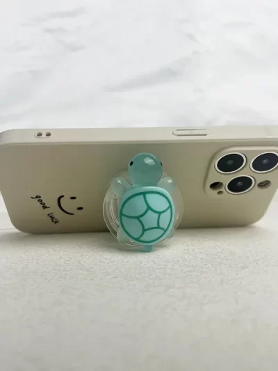 1PC Glow-in-the-Dark Turtle Phone Holder Mini Resin Turtle Design Expandable Folding Stand Non-Slip ABS Grip for Mobile Devices
